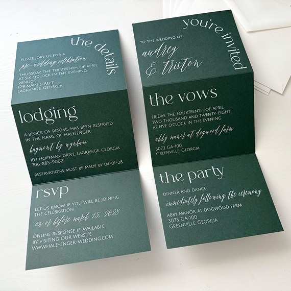 dark green invitation card with white text