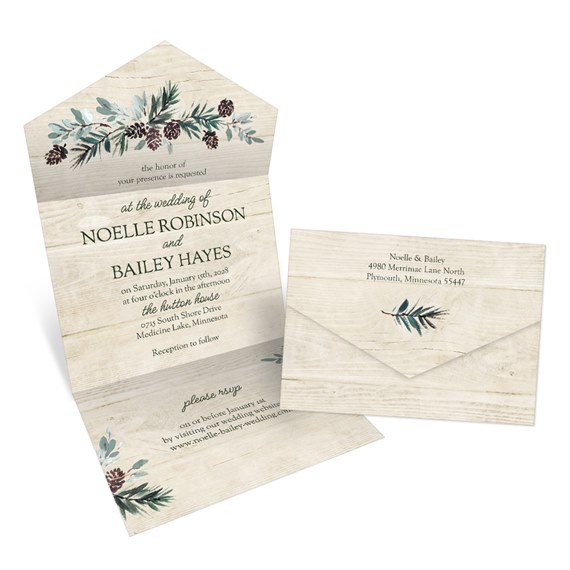 wedding invitation with greenery design and wooden texture