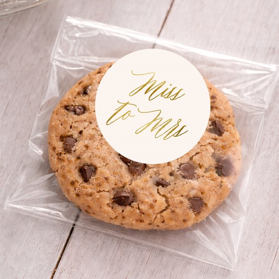 round sticker with text, cookie in clear bag
