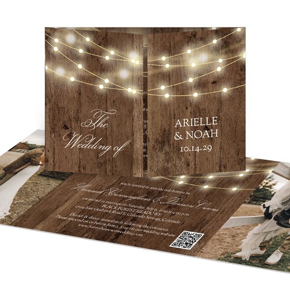 rustic wedding invitation with wood background and string lights