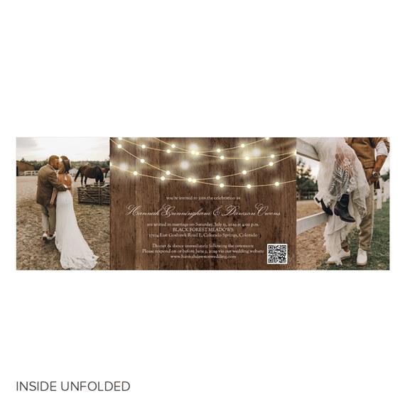 wedding invitation with string lights and wooden background