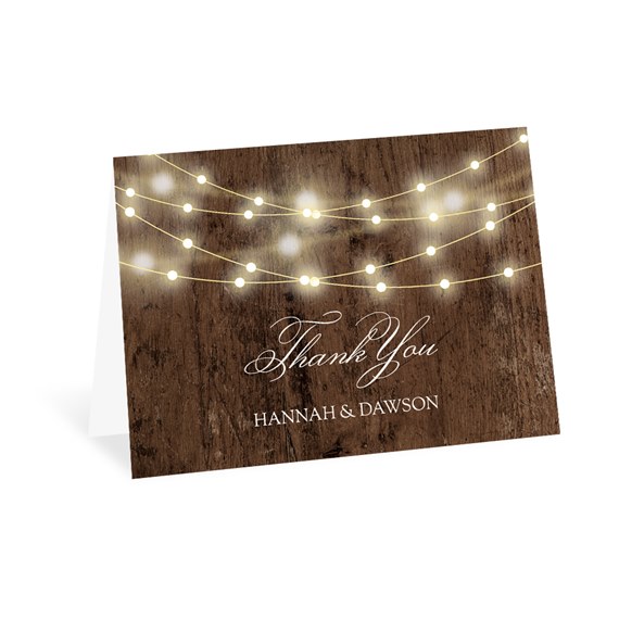 thank you card with rustic wood background and glowing string lights