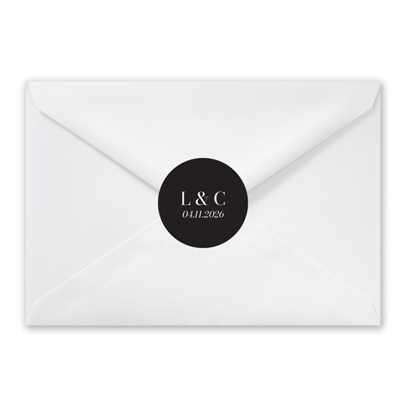 white envelope with black circular seal and initials