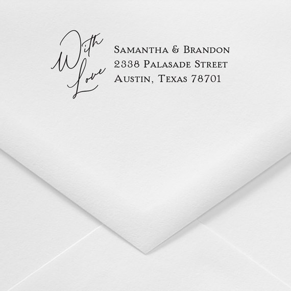 white envelope with printed address and cursive text